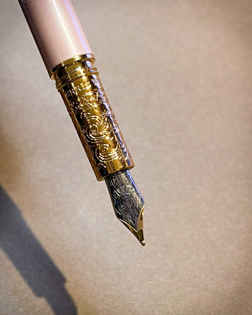 Ferris Wheel Press Bijou pen in Huffin Puff Pink colourway - closeup of grip and nib